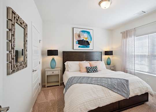 Bedroom with a large bed and a window  at The Meadows, Georgia, 31302
