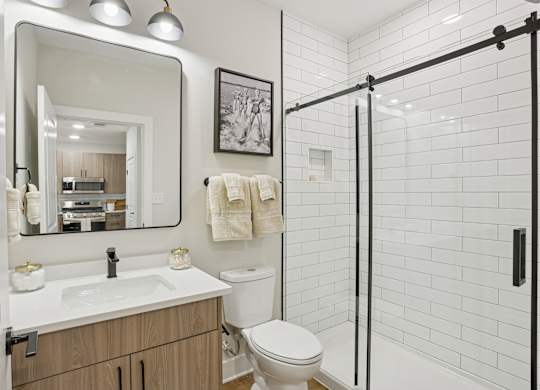 A bathroom with a white sink and toilet at Union Eleven Apartments, Atlanta, GA