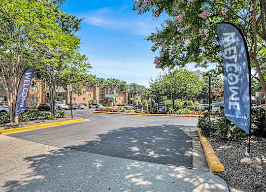 A street view of a residential area with a sign that reads "NETCO".