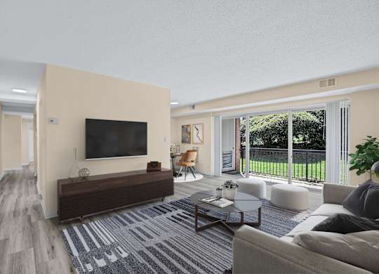 A living room with a television, a couch, and a coffee table.