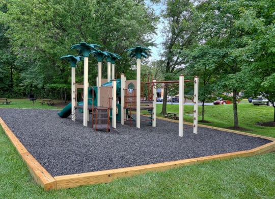 a playground with a set of play equipment in a park