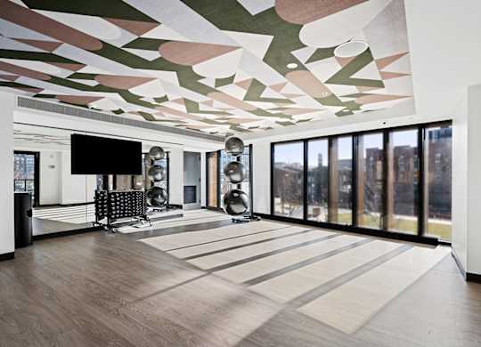 A modern room with a TV and a chair.