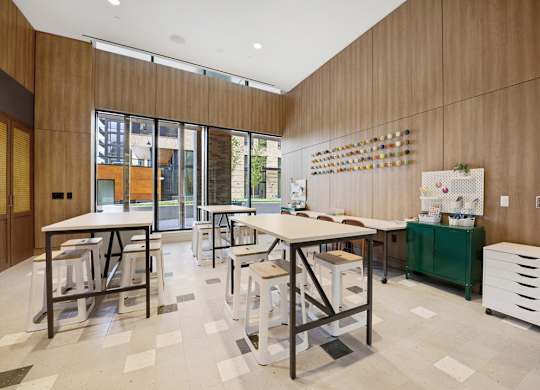 A room with a long table and chairs.