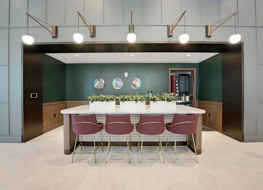 A conference room with a white table and chairs.