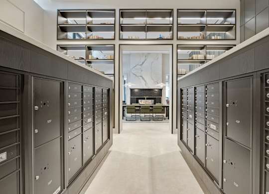 A long hallway with a row of lockers on each side.