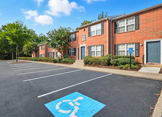 A parking lot with a handicap parking space.