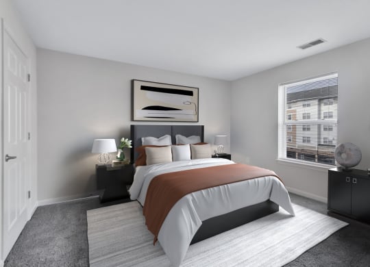 a bedroom with a bed and a window