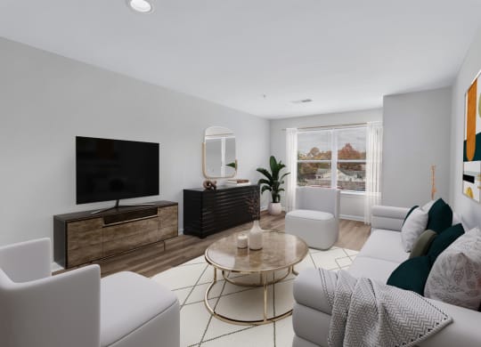 a living room with white furniture and a television
