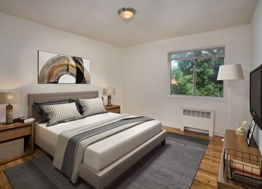 a bedroom with a white bed and a tv