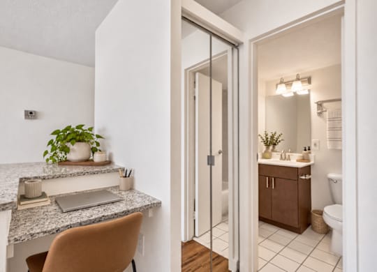 A bathroom with a sink and a mirror.