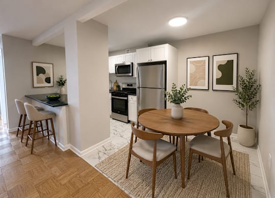 A kitchen with a table and chairs in the middle of the room.