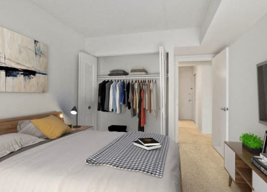 a bedroom with a bed and a closet with clothes