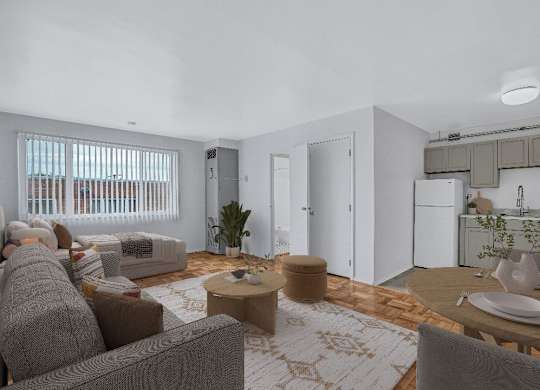 A modern living room with a grey couch and a wooden coffee table.