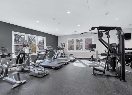 the gym is equipped with treadmills and other fitness equipment