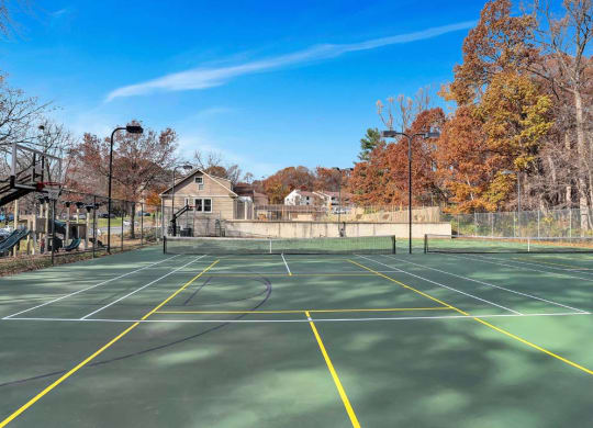 the tennis court is clean and ready for players to play