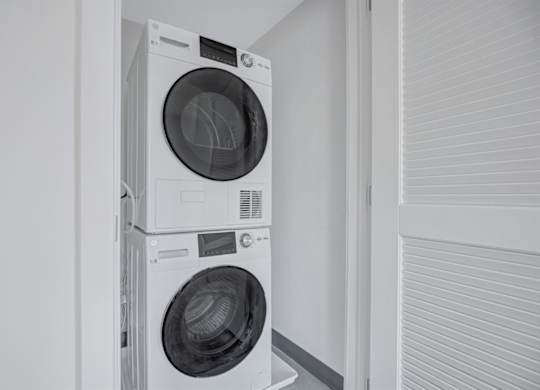 Two washing machines stacked on top of each other.