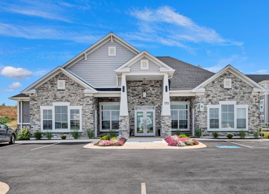 a large house with a parking lot in front of it