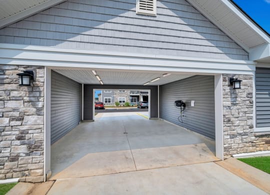 the drive way of a house with a concrete driveway