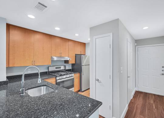 a kitchen with a granite counter top and a sink