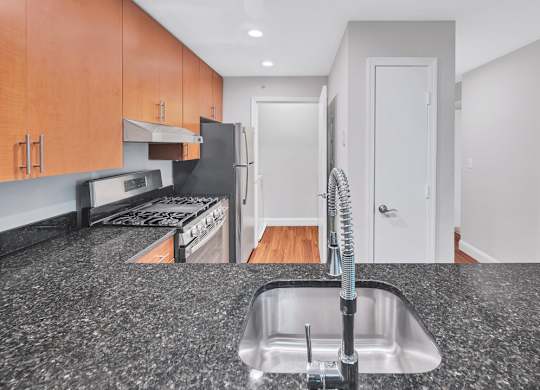 a kitchen with granite counter tops and a sink