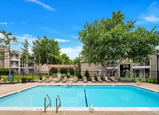 the preserve at ballantyne commons pool and trees with apartment buildings