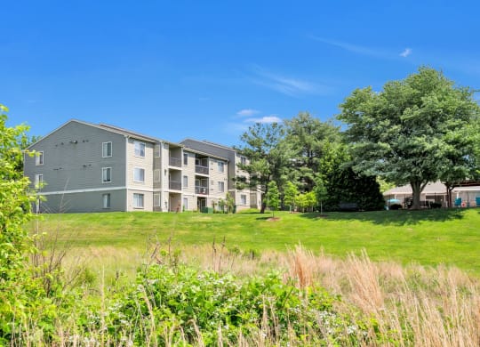 An exterior view from the lake of Waterside at Reston.
