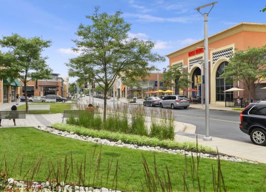 a rendering of a park in front of a shopping center