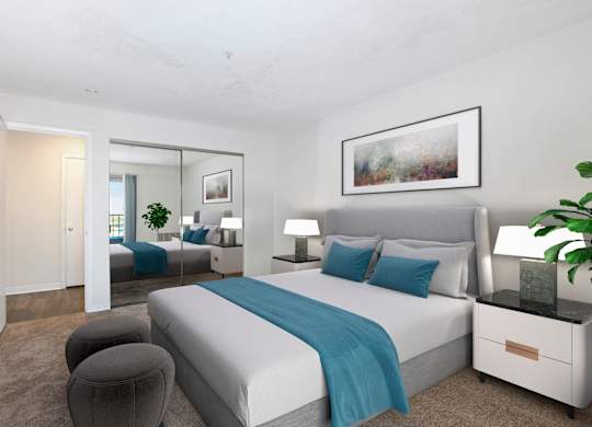 A bedroom with a large bed and a mirror on the wall.