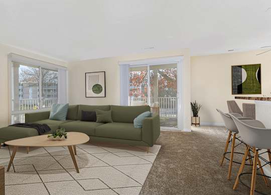 A living room with a green couch and a coffee table.