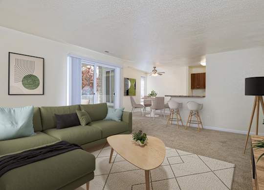 A living room with a green couch and a wooden coffee table.