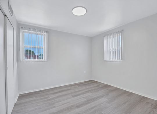 A room with a window and a door.