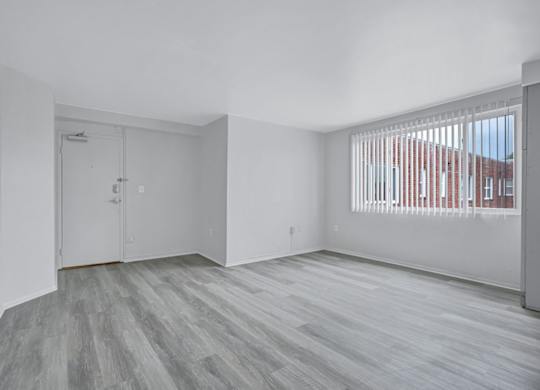 A room with a grey floor and white walls.