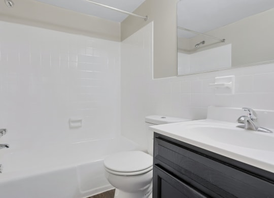 a bathroom with a toilet and a sink