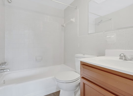 a bathroom with a sink toilet and a bath tub