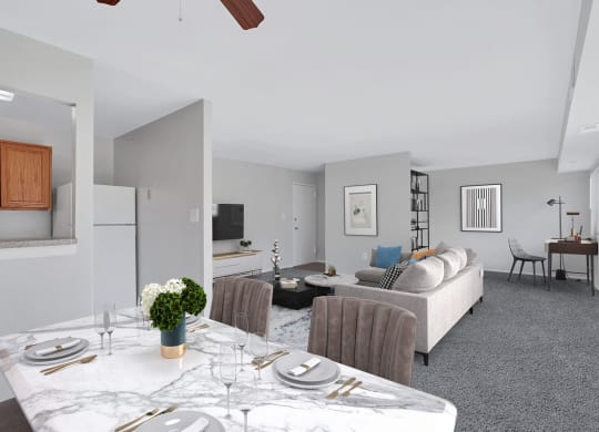 a living room and dining room with a table and chairs