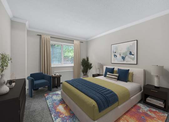 A bedroom with a bed, a chair, and a painting on the wall.