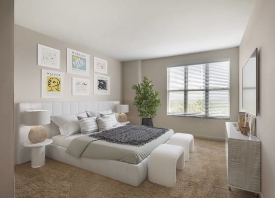 a white bedroom with a bed and a mirror