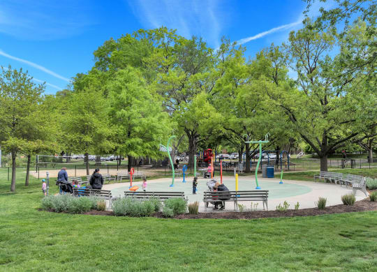 a playground in a park with people playing on it