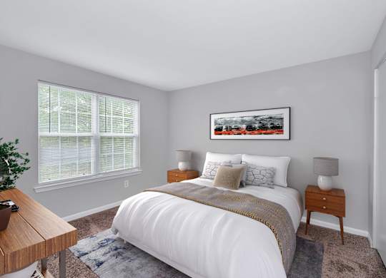 An apartment bedroom with bright window with blinds; showing bed and with night stands on both sides.