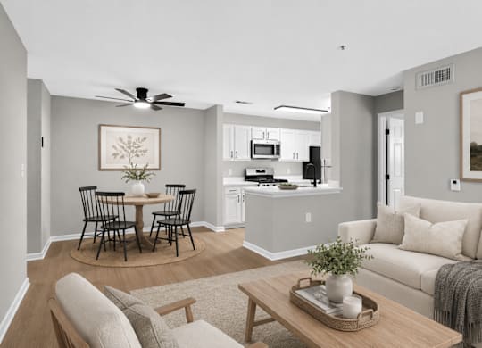 A living room with a dining table and chairs.