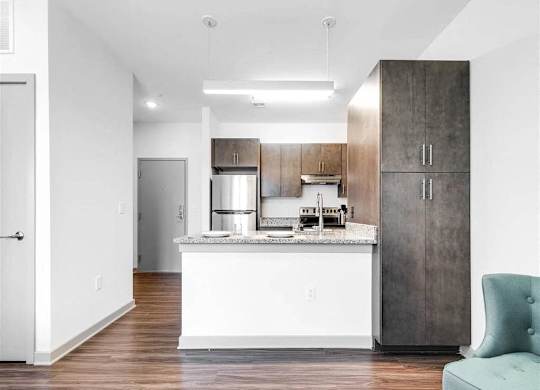 a kitchen with a counter top and a refrigerator