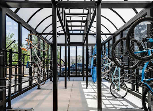 a row of bikes parked in a building