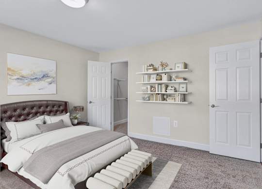 A bedroom with a large bed and a painting on the wall.