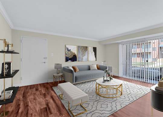 A living room with a grey couch and a coffee table.