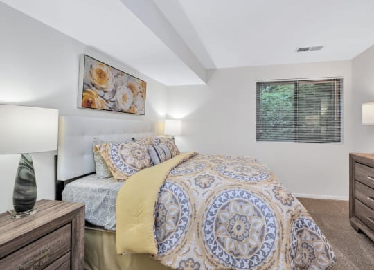 a bedroom with a bed and two night stands