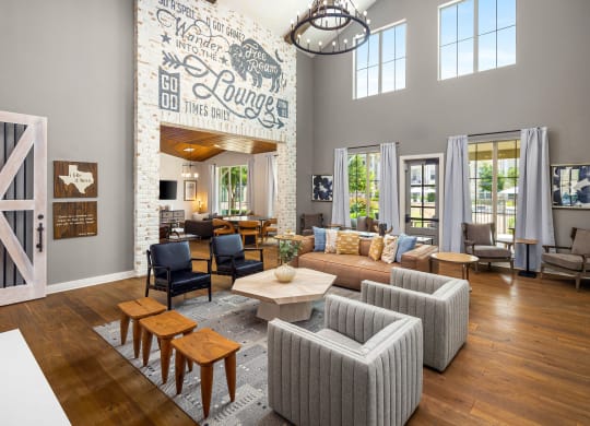 a living room with a couch and chairs and a table