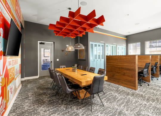 a conference room with a wooden table and chairs