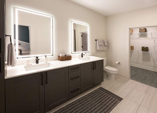 a bathroom with two sinks and a shower and a toilet