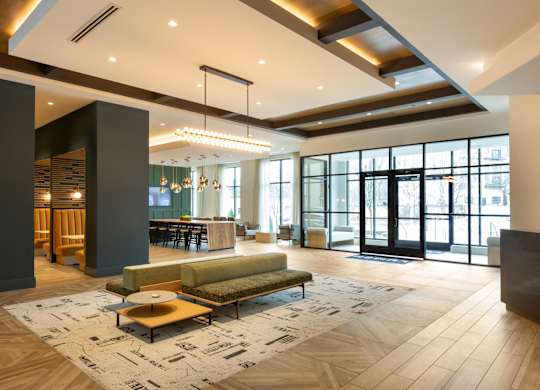 a large lobby with a couch and a coffee table