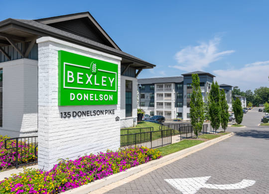 a building with a sign on the side of a road